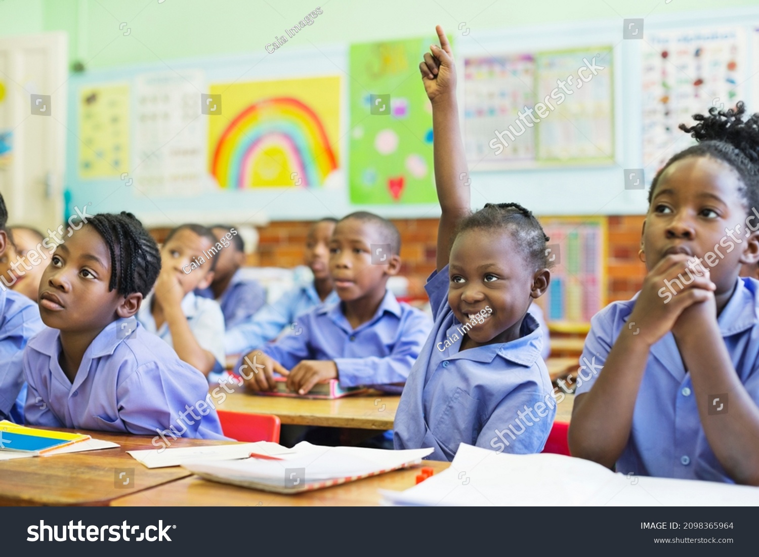 stock-photo-student-raising-hand-in-class-2098365964